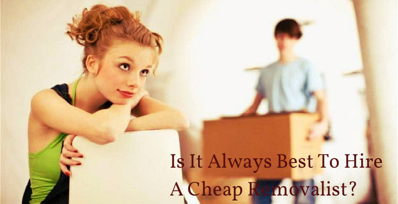A girl sitting and wondering while a guy carries a packed box