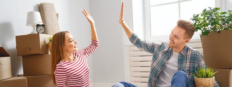 a happy couple preparing for a relocation
