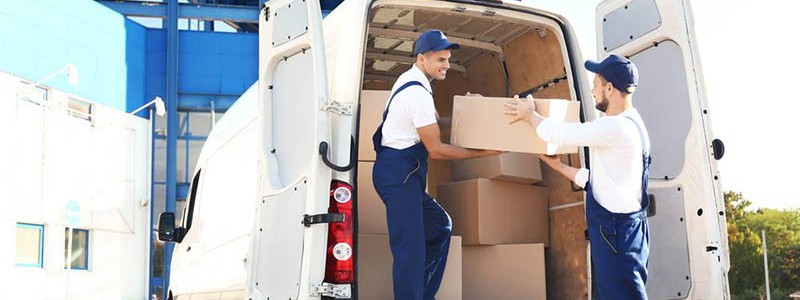young professionals unloading a moving van
