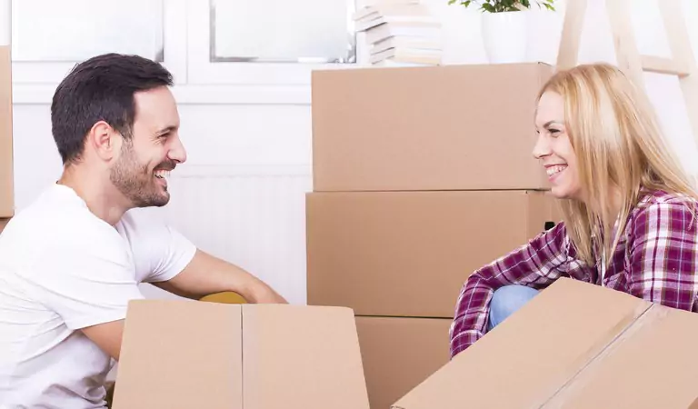 couple sitting on the floor and looking at each other