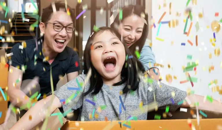 family looking happy inside of their new house