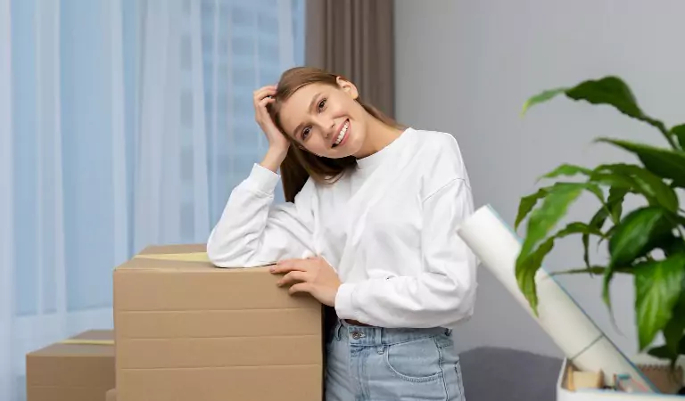 woman inside of a new house with her household