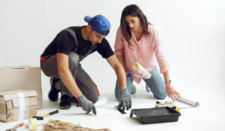 couple inside of a new house and discussing something