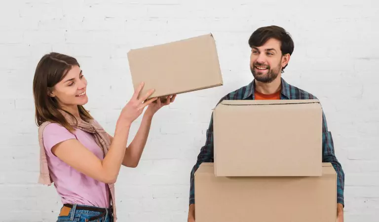 couple with some moving boxes ready for a house move