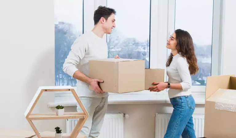 couple inside of a new house looking happy