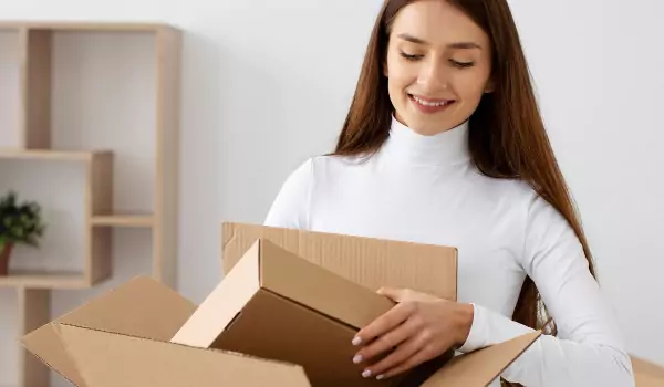 woman with packing box and preparing for a move
