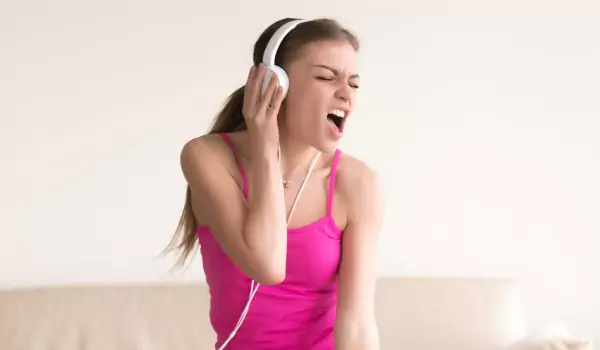 woman enjoying music at home