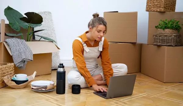 woman calculating something on a computer