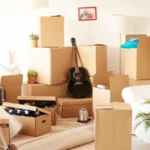 Top view of messy and full of moving boxes room